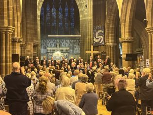 Fron choir and Mersey Wave perform on stage at Mossley Hill Church during the summer concert 2024